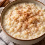 A bowl of arroz con leche ready to serve