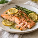 Roasted lemon dill fish served with asparagus, an option for the best way to cook salmon