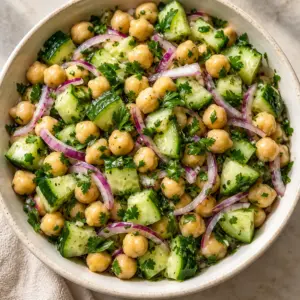 Chickpea cucumber salad in a square overhead view