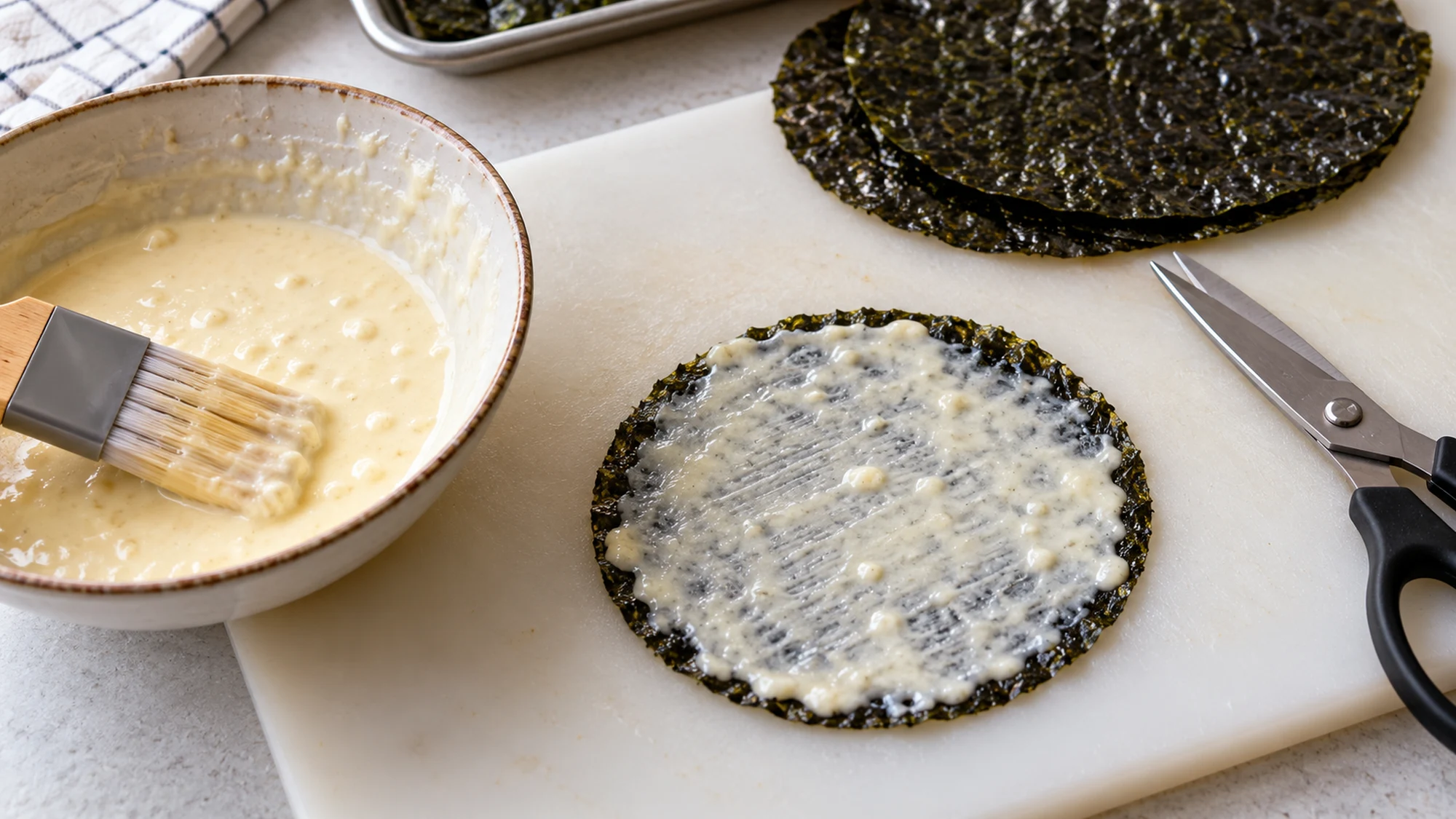 A nori circle lightly brushed with batter before frying