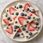 frozen yogurt bark with berries and chocolate chips, overhead