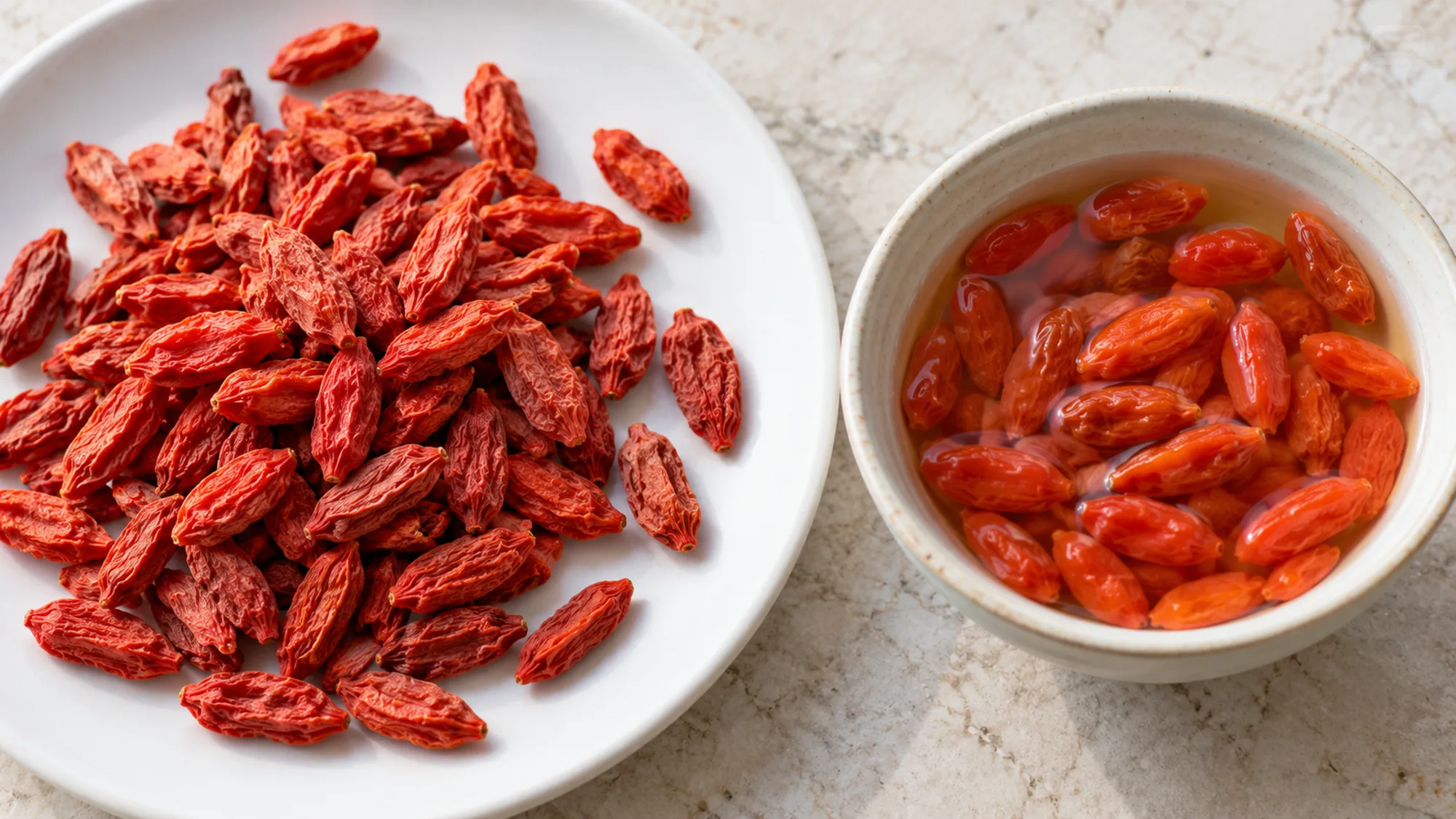 Dried goji berries beside berries soaking in water