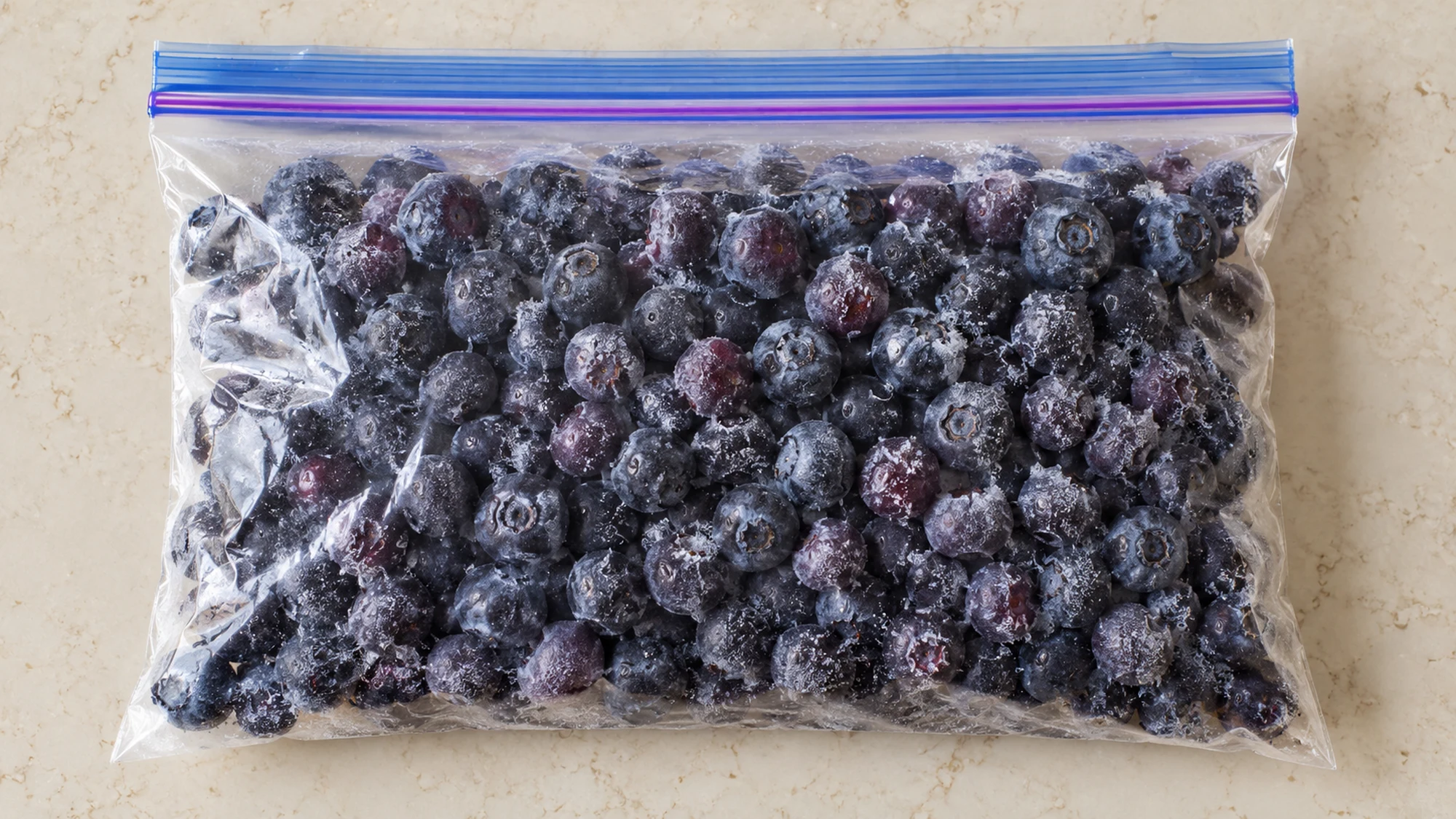 Tightly sealed blueberries illustrating how to prevent freezer burn with less trapped air