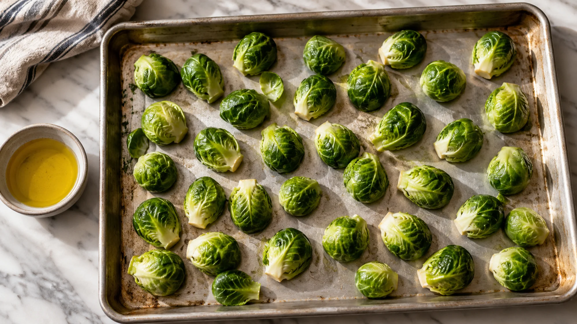 How to roast Brussels sprouts: dry halves spaced cut-side down on a sheet pan