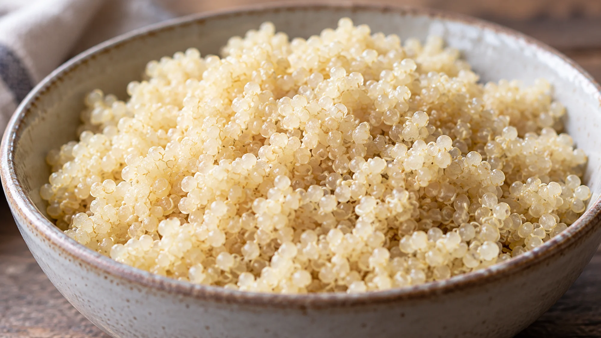 Close view of plain cooked quinoa with small visible germ rings