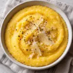 Soft polenta with Parmesan and pepper in a bowl